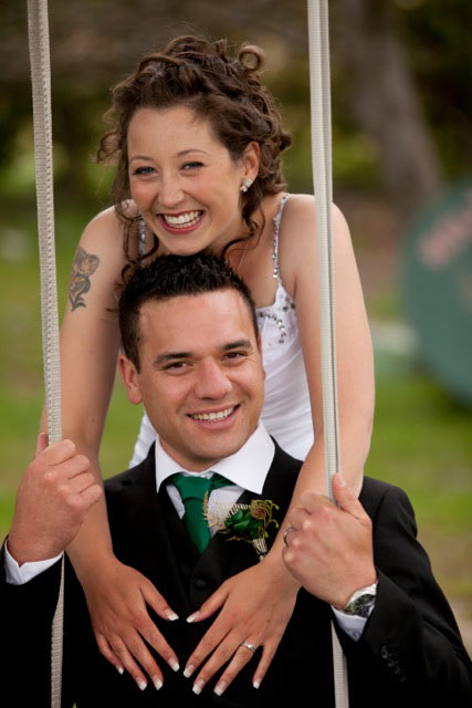 Bride and groom on swing